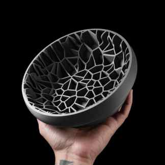 Highly detailed 3D printed geometric object showcasing complex lattice design for industrial use.