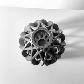Detailed black and white 3D printed engineering part with intricate geometric design.
