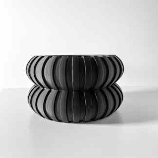 Stylish black WALI planter with sleek, creative design ideal for stylish home or office.