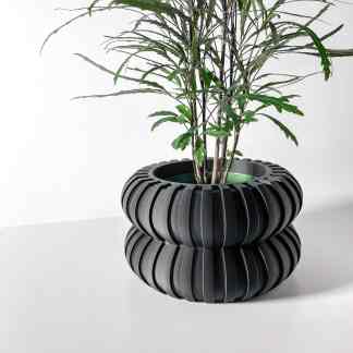 3D printed black planter with contemporary layered design, perfect for indoor plants and home decor.