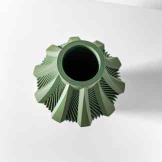 Decorative green ceramic vase with a modern textured pattern, ideal for home decor.