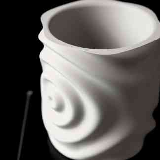 Detailed view of a modern 3D printed sculpture, highlighting surface texture and artistic form.