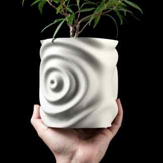 Unique 3D printed plant pot with wave pattern, ideal for modern interior decoration.