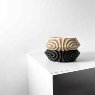 Elegant beige and black WENRA planter with intricate ridged patterns.