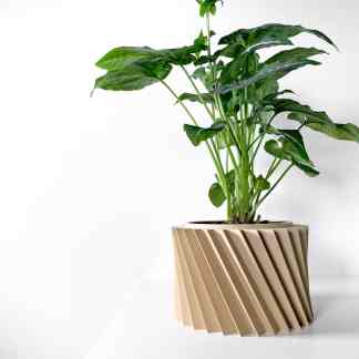 Vivid green plant in beige 3D-printed geometric flower pot.
