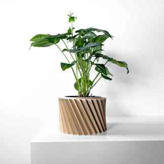Vibrant green plant in a stylish beige 3D-printed planter from AM Square 3D.