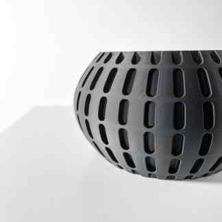Modern black 3D-printed vase with geometric pattern, perfect for contemporary home decor.