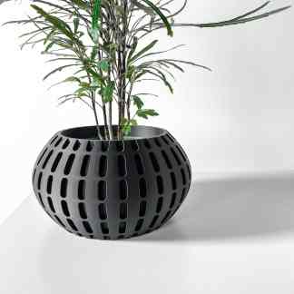 A sleek black 3D-printed plant pot with unique polygonal cutouts, perfect for modern indoor plants.