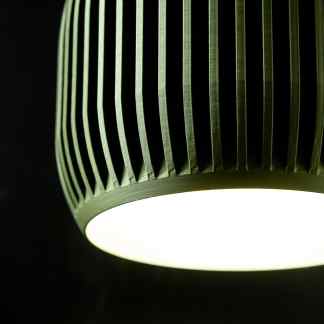 Close-up of a contemporary 3D-printed LED lamp featuring detailed cutouts and modern design aesthetics.