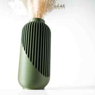 Modern green vase with vertical ridges, stylishly holding dried flowers.