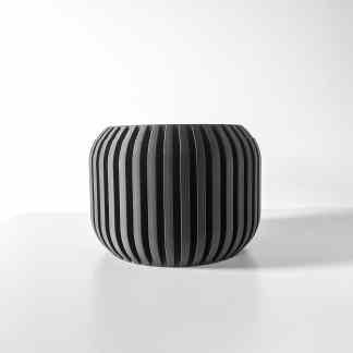 Sleek black 3D-printed vase with vertical slats, perfect for modern home decor and artistic display.