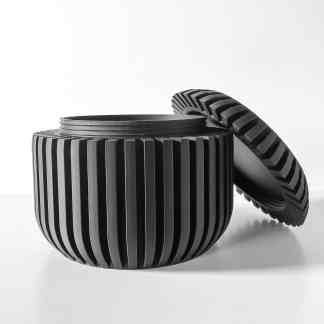Highly detailed, black 3D-printed gear with finely textured teeth, designed for technical applications.