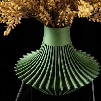 Detailed image of a modern, eco-friendly 3D printed green vase with intricate pleated design.