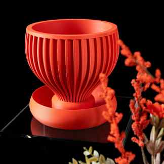 Durable 3D-printed YINPLANTER pot with ribbed detailing in vibrant red, ideal for contemporary home or office plant displays.
