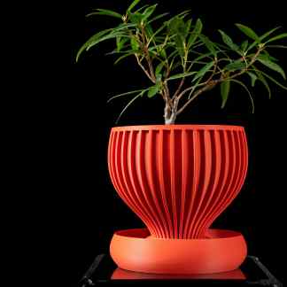 Vivid red 3D-printed plant pot with unique radial design, perfect for modern interior decor.