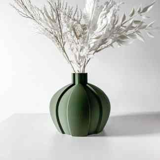 Elegant green vase with white dried flowers, perfect for contemporary interior decor and modern aesthetics.