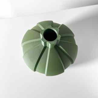 Detailed view of a 3D-printed green decorative vase with unique ribbed design and intricate top opening.