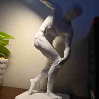 Elegant white sculpture of Discobolo inspired modern lamp, perfect for contemporary interior design.