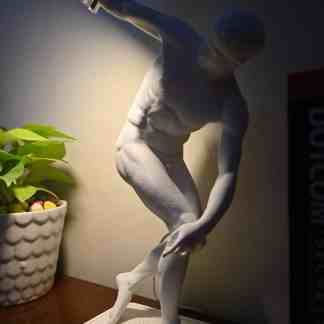 Elegant designer lamp inspired by classical sculpture, perfect for contemporary interior decor.