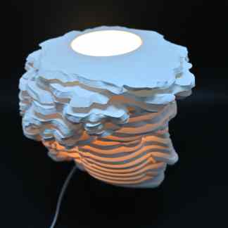 Illuminated 3D-printed lamp with layered paper texture, modern decor piece, ideal for stylish interiors.