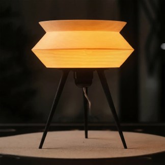 Gorshok table lamp with sleek modern design and warm ambient light for home decor.