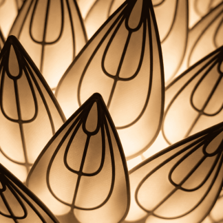 Artistic Prisma petal lamp with intricate 3D design and warm lighting.