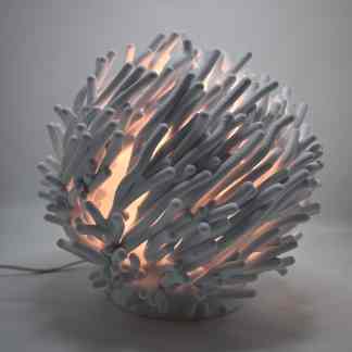 Shaped 3D printed lamp with ambient lighting.